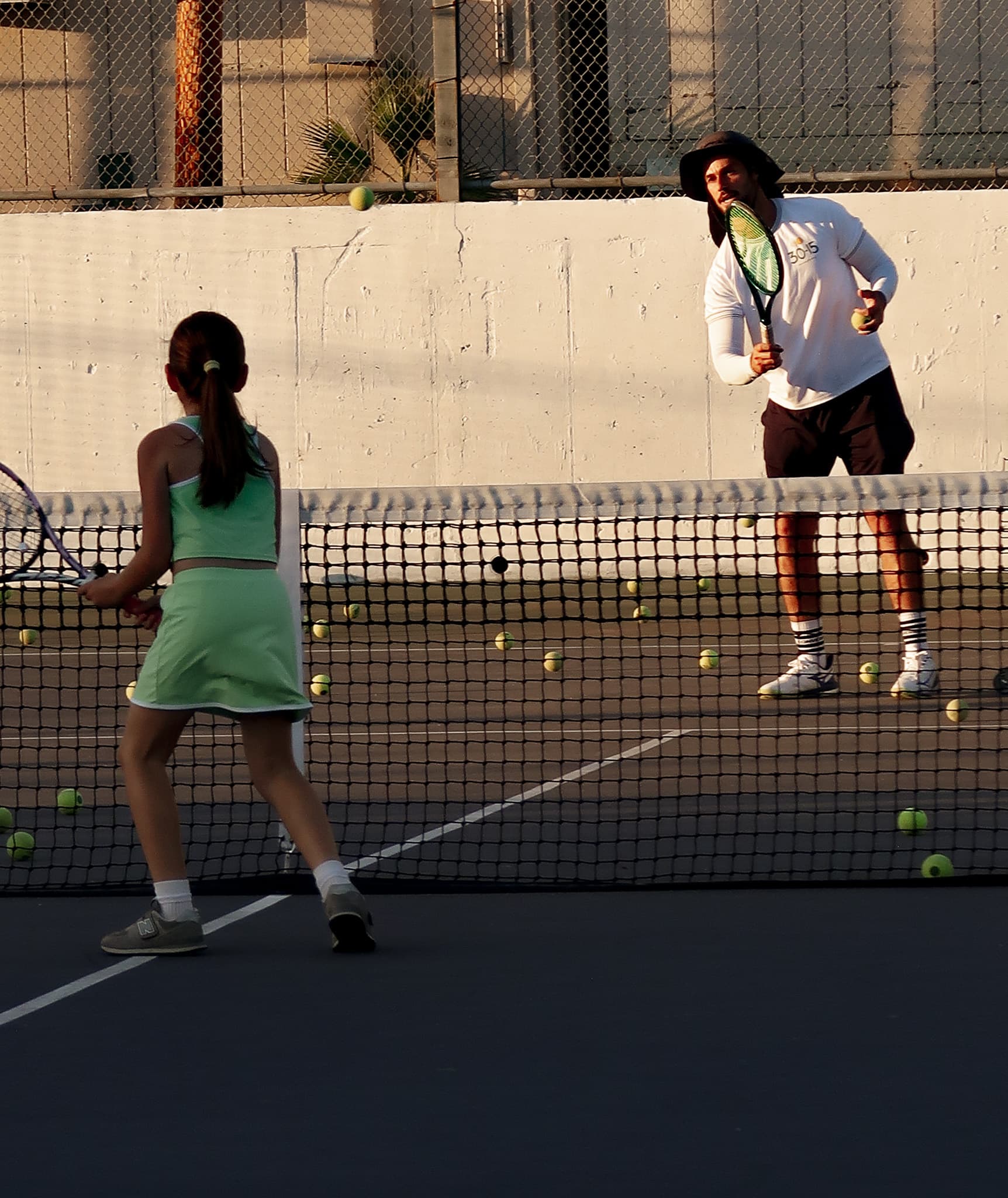 Tennis coaching plans and memberships in Glendale featuring a coach instructing players on court with pricing tiers and program options banner image